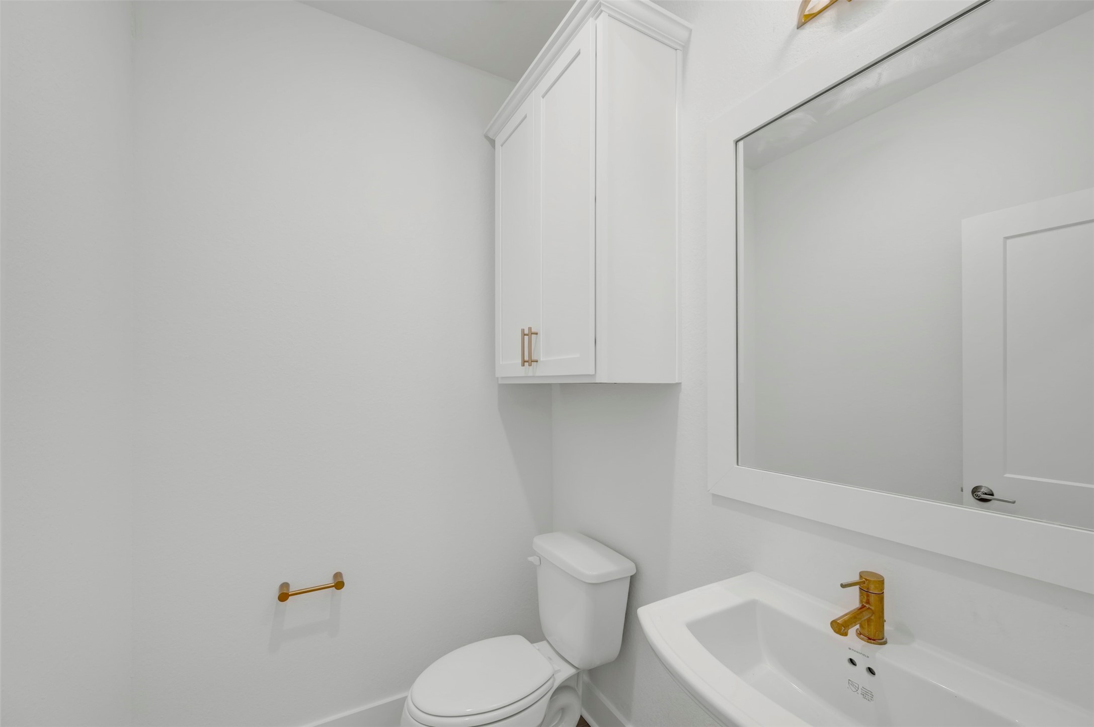 467 6th Street Magnolia, TX 77355 - Photo 24 of 50 a bathroom with a sink a toilet and mirror