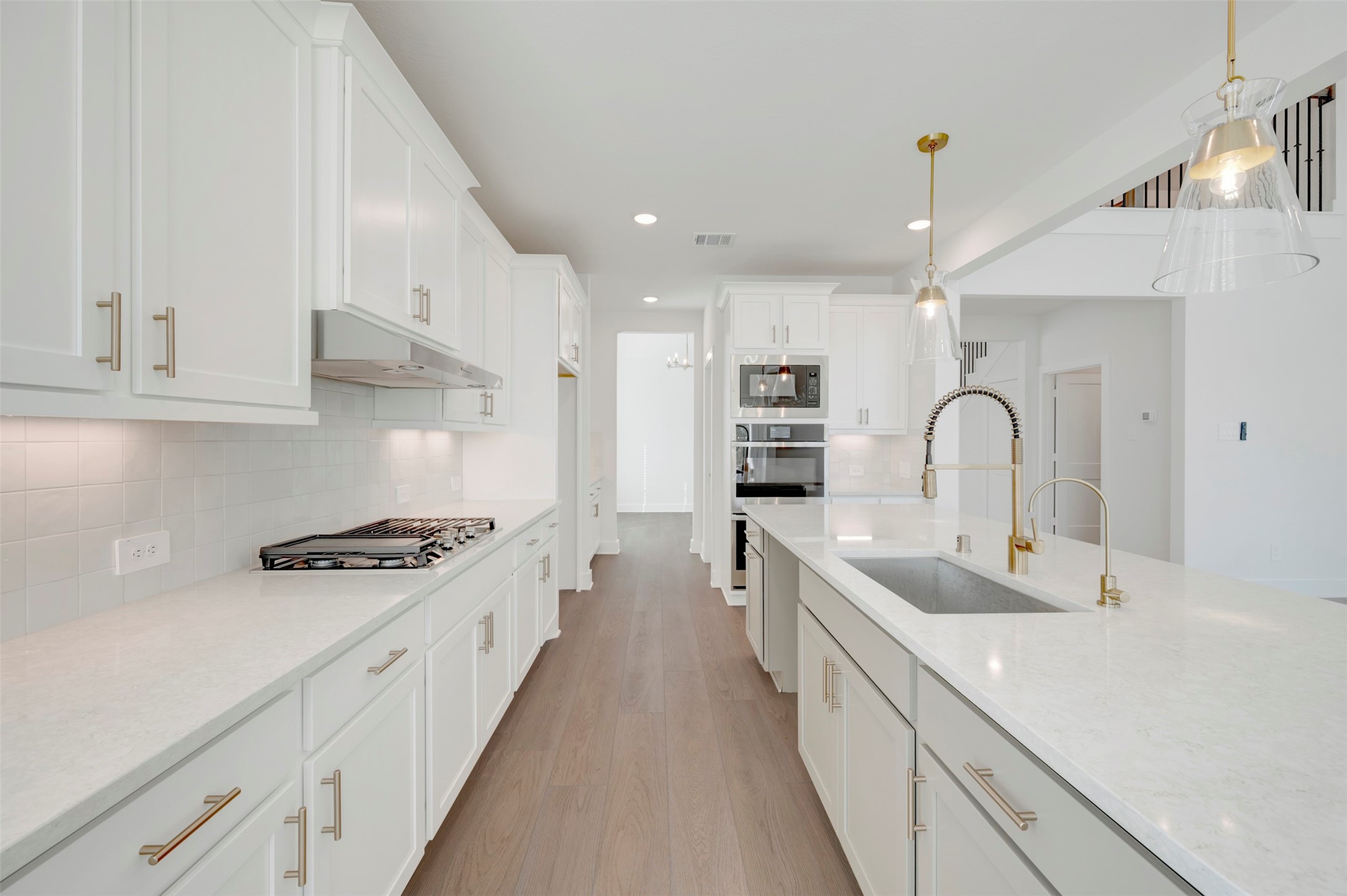 467 6th Street Magnolia, TX 77355 - Photo 29 of 50 a kitchen with stainless steel appliances a sink stove and cabinets