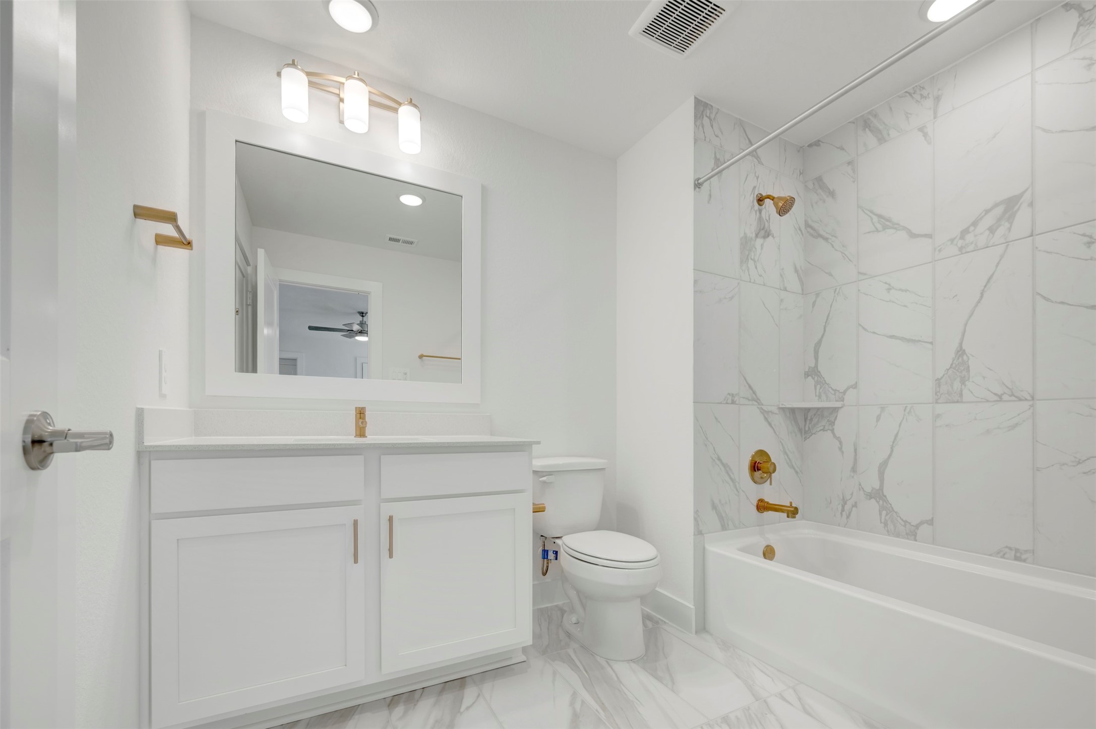 467 6th Street Magnolia, TX 77355 - Photo 47 of 50 a bathroom with a sink a toilet and a bathtub