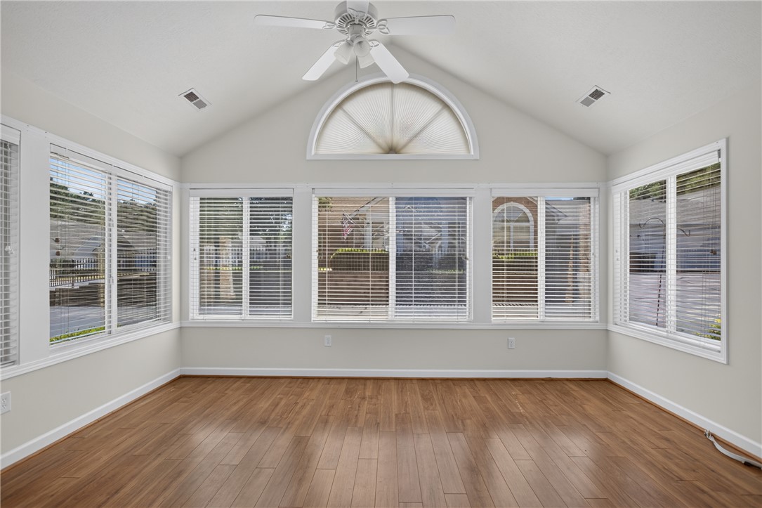 134 Life Style Lane Anderson, SC 29621 - Photo 9 of 44 A well-lit sunroom showcases rich hardwood flooring and abundant natural light.