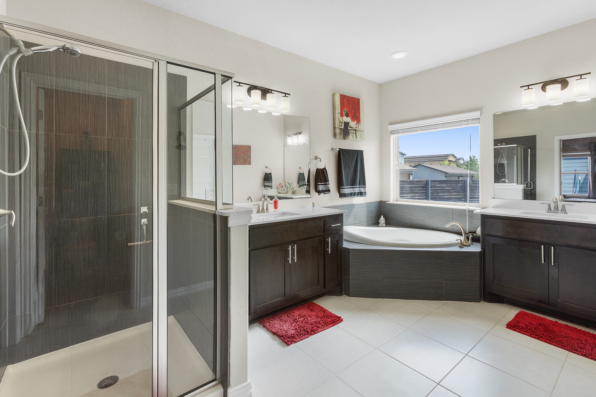 8709 Slater Drive Austin, TX 78747 - Photo 17 of 36 a bathroom with a tub sink shower and mirror