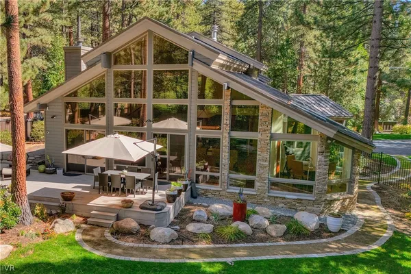 a blue and white house with outdoor space