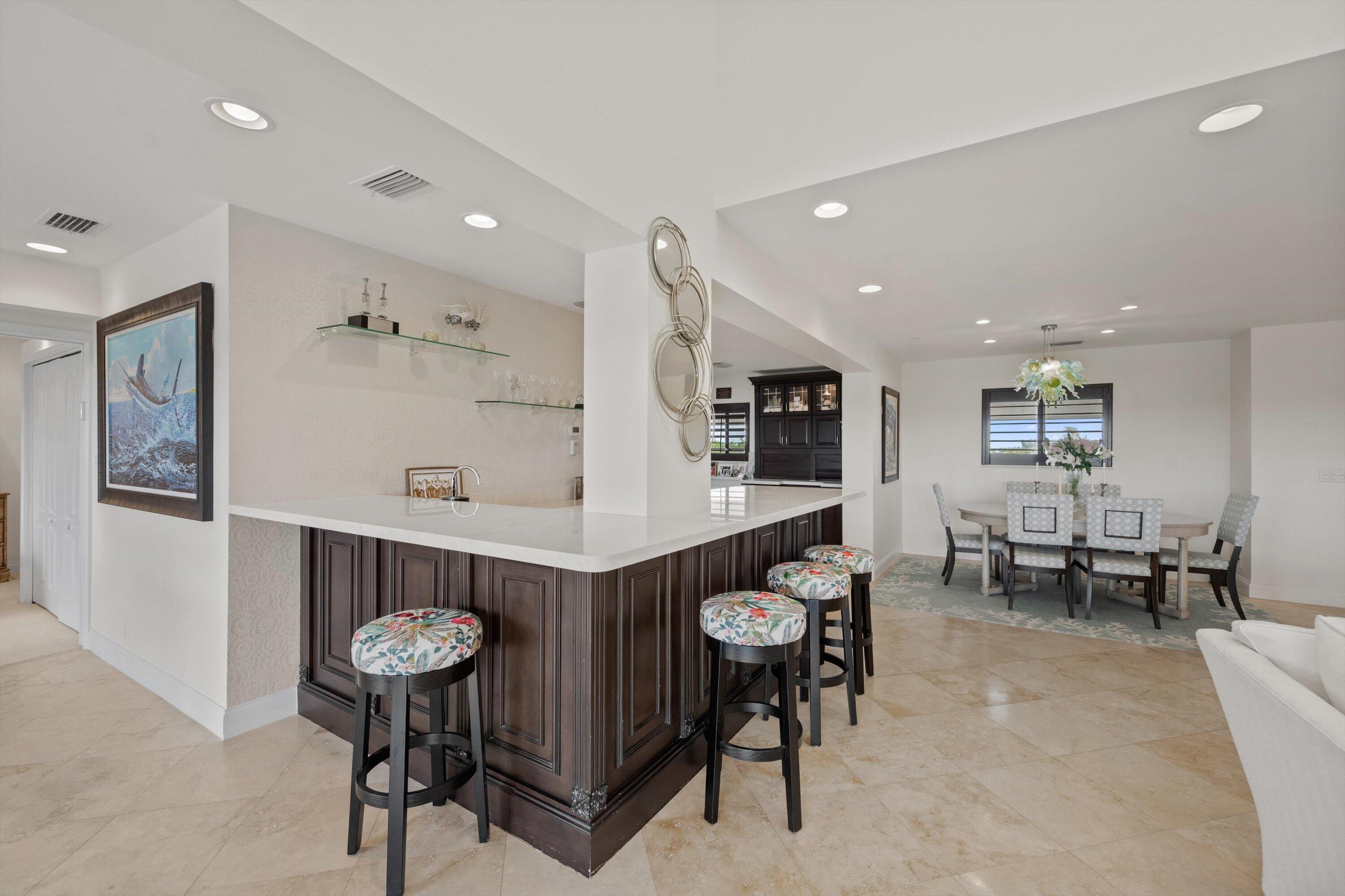 16910 Bay Street, Unit E 502 Jupiter, FL 33477 - Photo 14 of 43 a living room with furniture and a table
