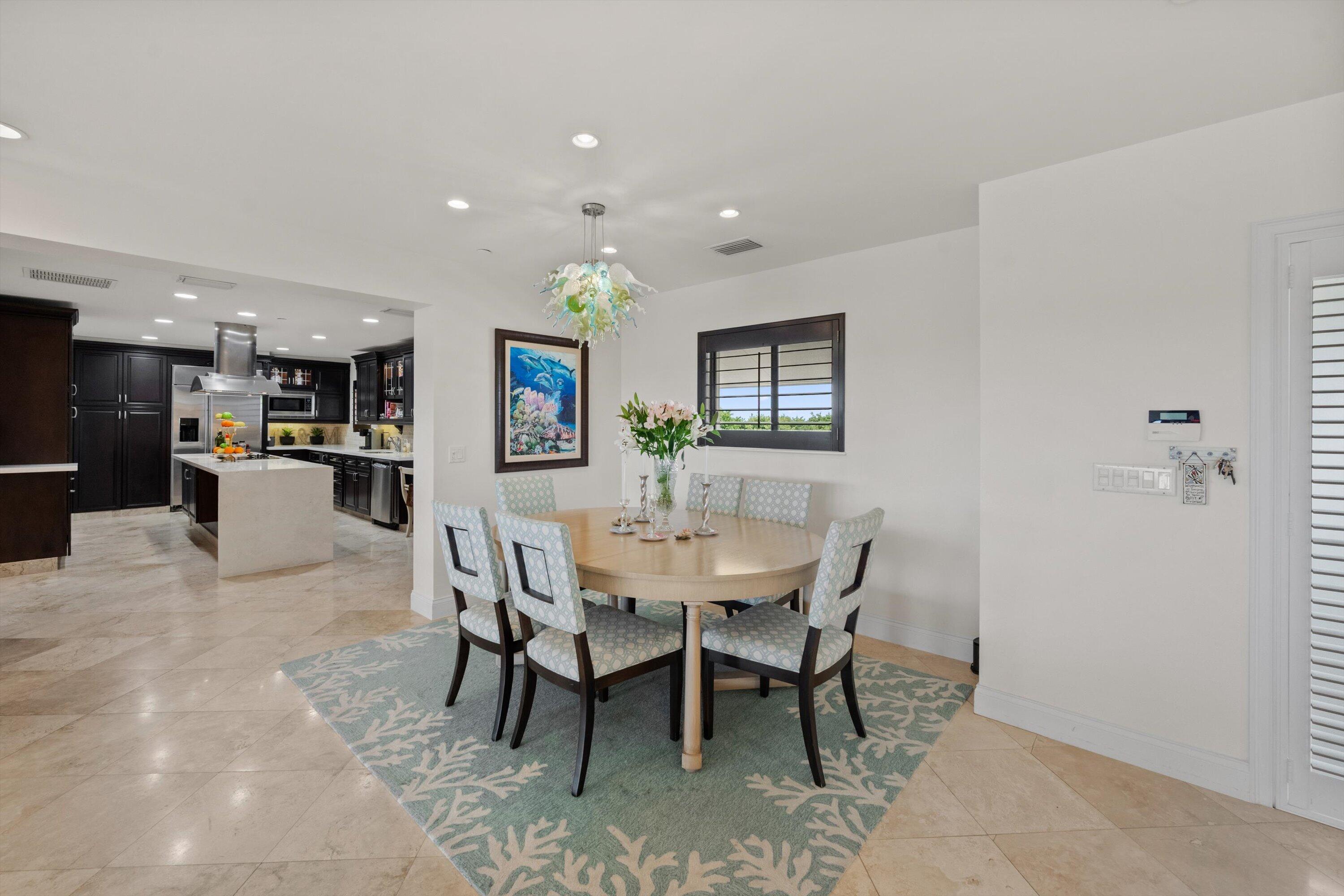 16910 Bay Street, Unit E 502 Jupiter, FL 33477 - Photo 17 of 43 a view of a dining room with furniture