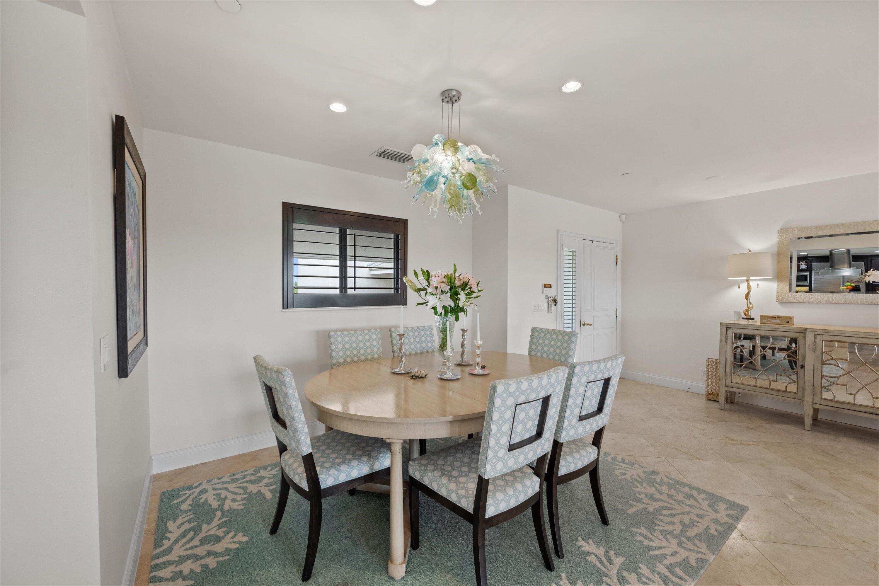 16910 Bay Street, Unit E 502 Jupiter, FL 33477 - Photo 18 of 43 a dining room with furniture and window