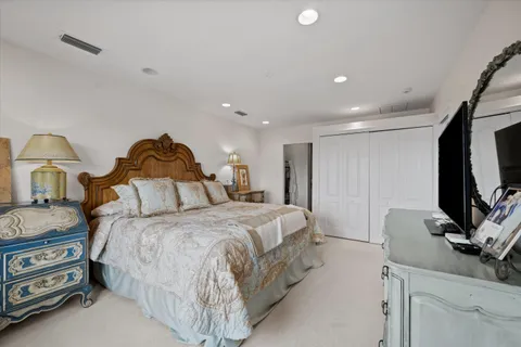 a bedroom with a bed and a couch
