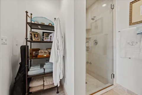 a bathroom with a granite countertop toilet and a sink