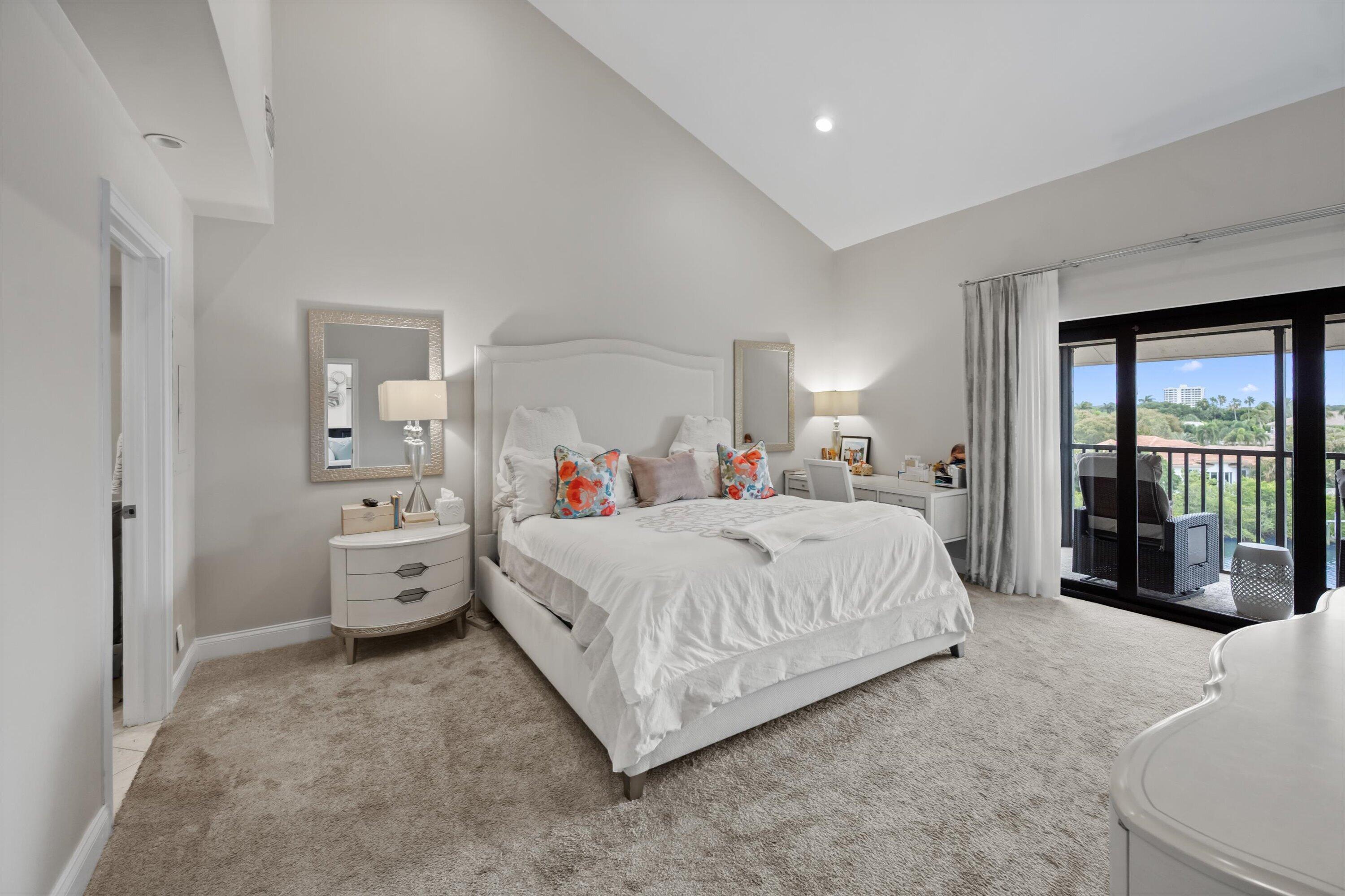 16910 Bay Street, Unit E 502 Jupiter, FL 33477 - Photo 33 of 43 a bed room with a bed and a large window