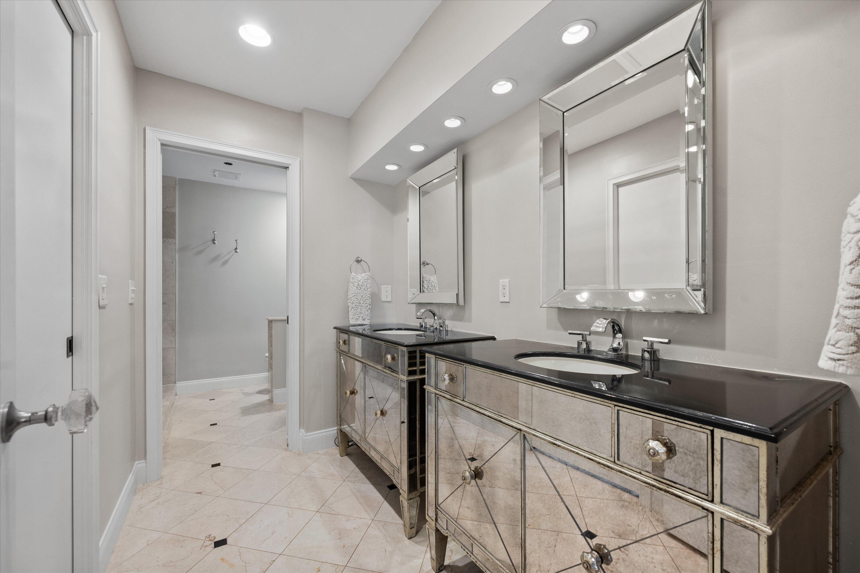 16910 Bay Street, Unit E 502 Jupiter, FL 33477 - Photo 35 of 43 a bathroom with a sink double vanity and a mirror