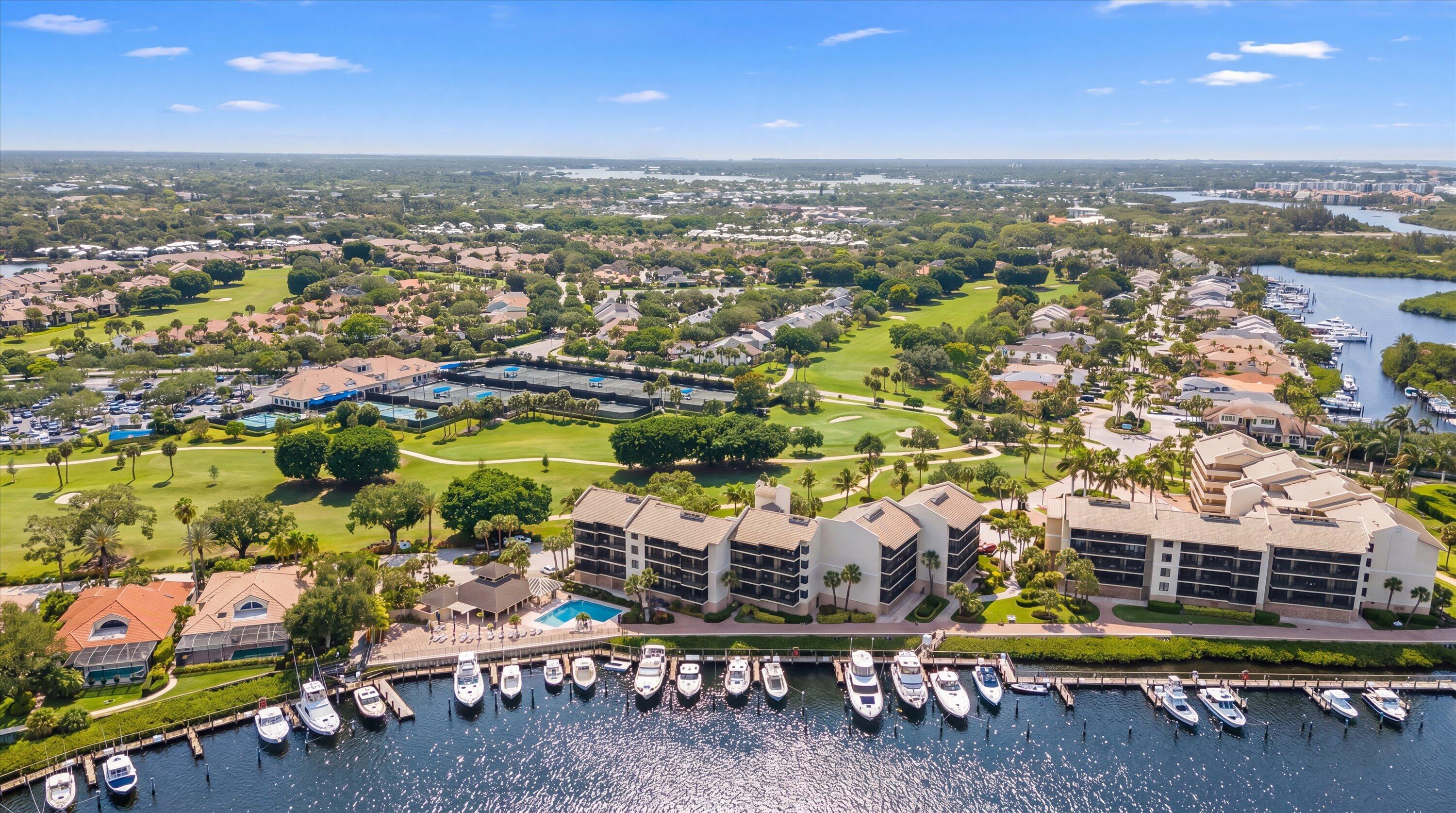 16910 Bay Street, Unit E 502 Jupiter, FL 33477 - Photo 37 of 43 an aerial view of residential houses with outdoor space and seating area