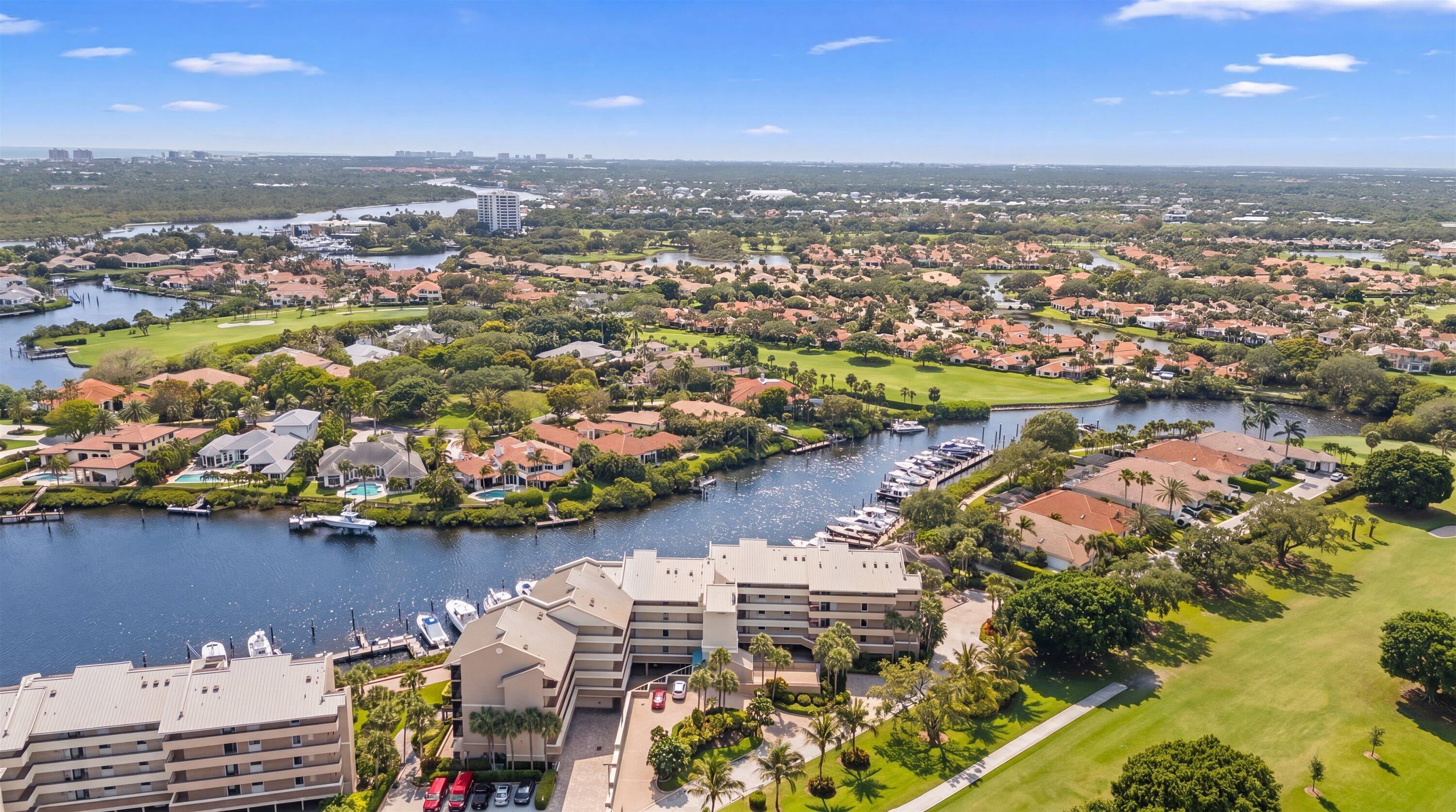 16910 Bay Street, Unit E 502 Jupiter, FL 33477 - Photo 40 of 43 an aerial view of lake and residential houses with outdoor space