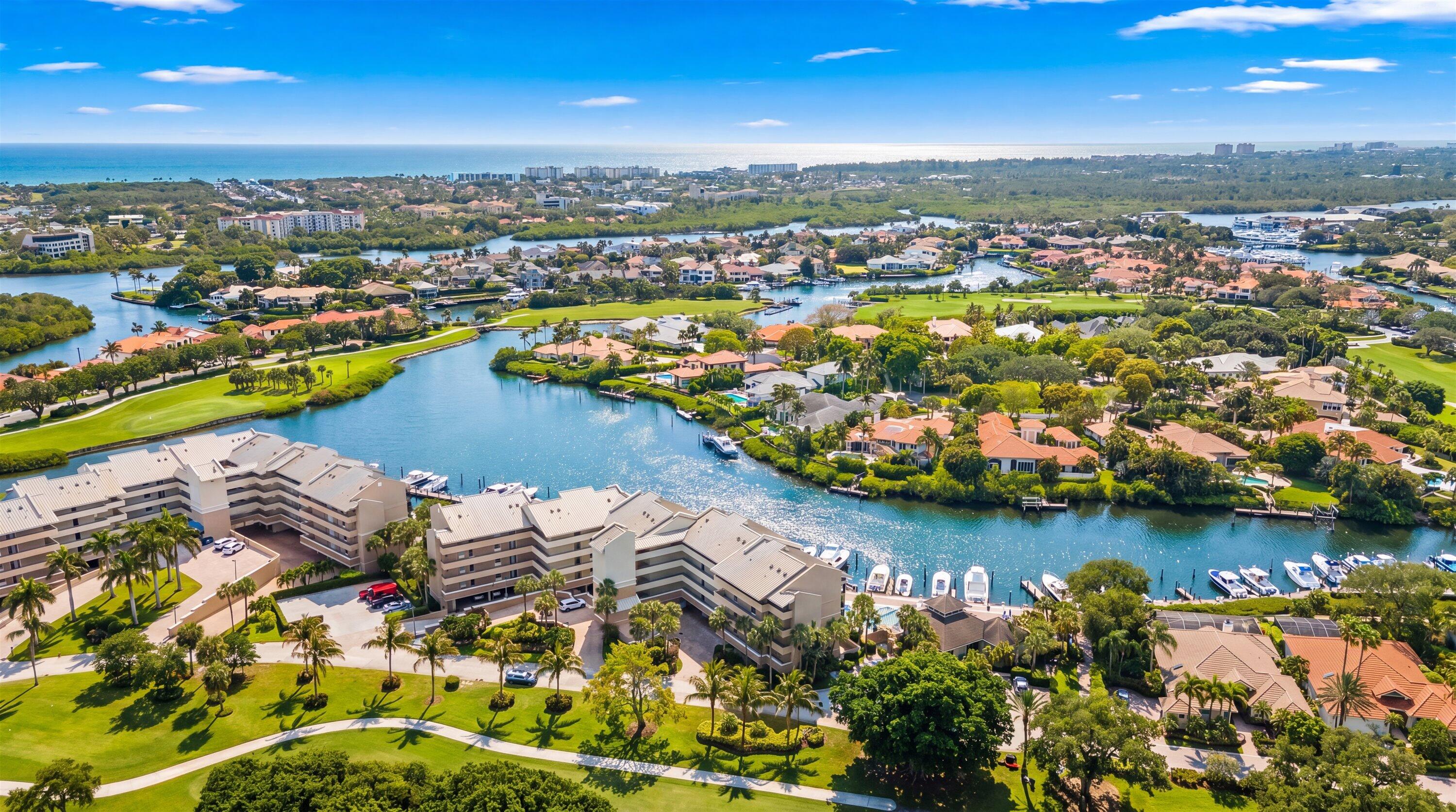16910 Bay Street, Unit E 502 Jupiter, FL 33477 - Photo 42 of 43 an aerial view of residential houses with outdoor space