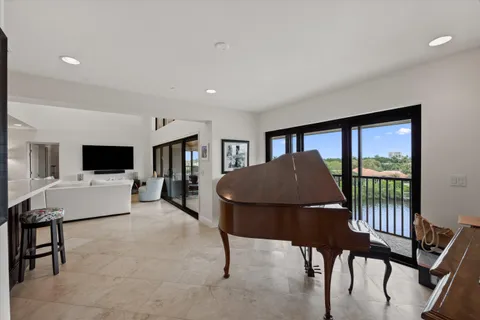 a living room with furniture tv and a window