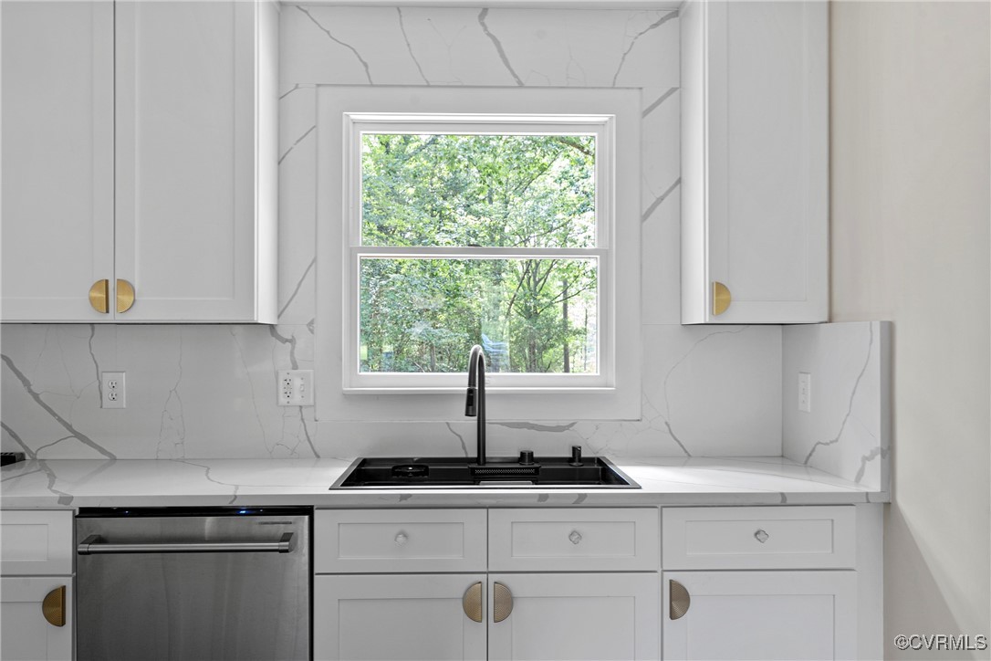 113 Rappa Run Road Topping, VA 23169 - Photo 14 of 49 Kitchen with dishwasher, white cabinetry, backspla