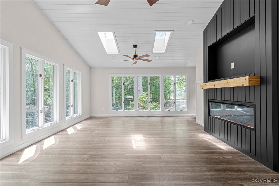 113 Rappa Run Road Topping, VA 23169 - Photo 15 of 49 Unfurnished living room featuring vaulted ceiling,