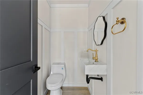 a bathroom with a toilet and a sink