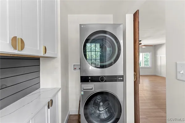 a view of a hallway with washer and dryer