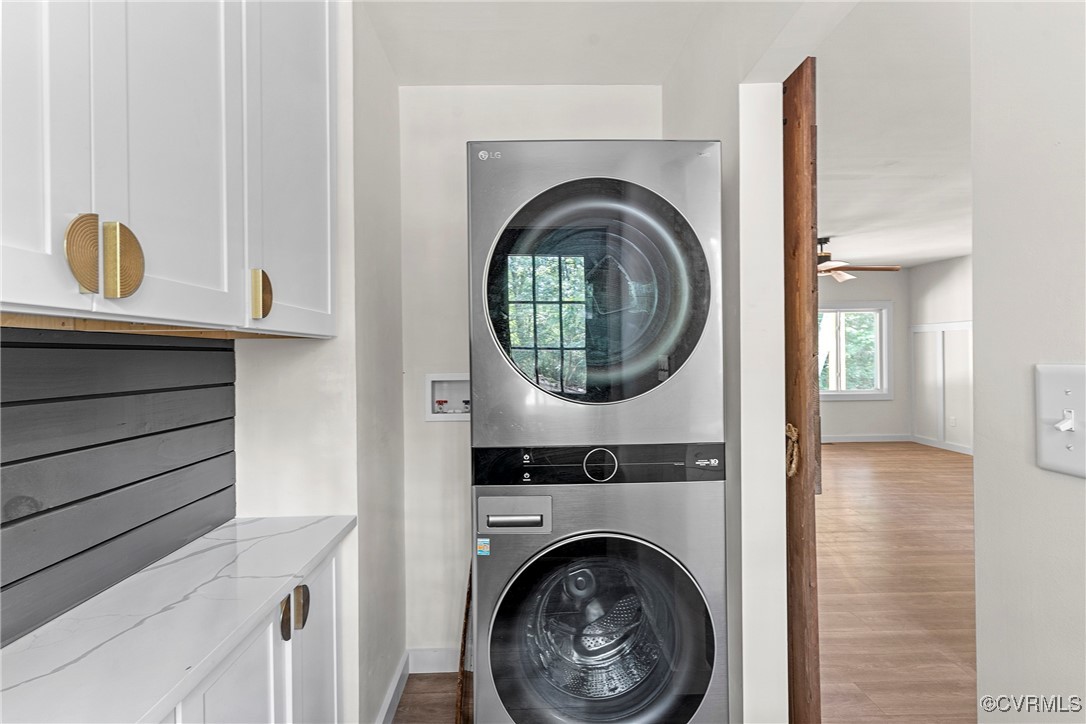 113 Rappa Run Road Topping, VA 23169 - Photo 22 of 49 Laundry room with stacked washing machine and drye