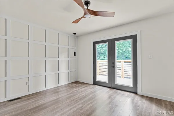 wooden floor in an empty room with a window