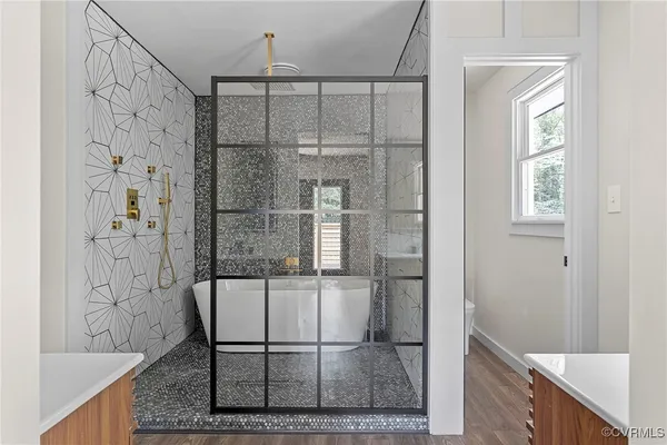 a bathroom with a shower and a sink