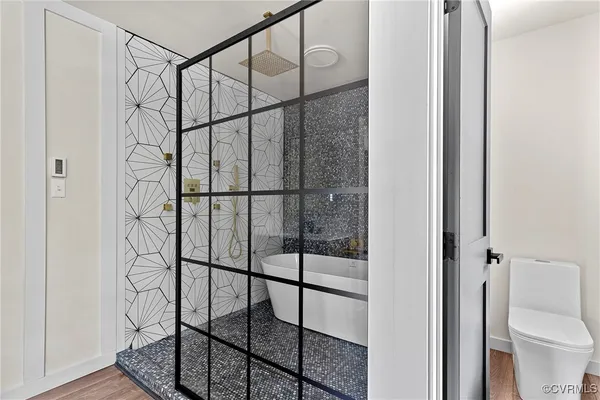 a room that has a chair and a window in it