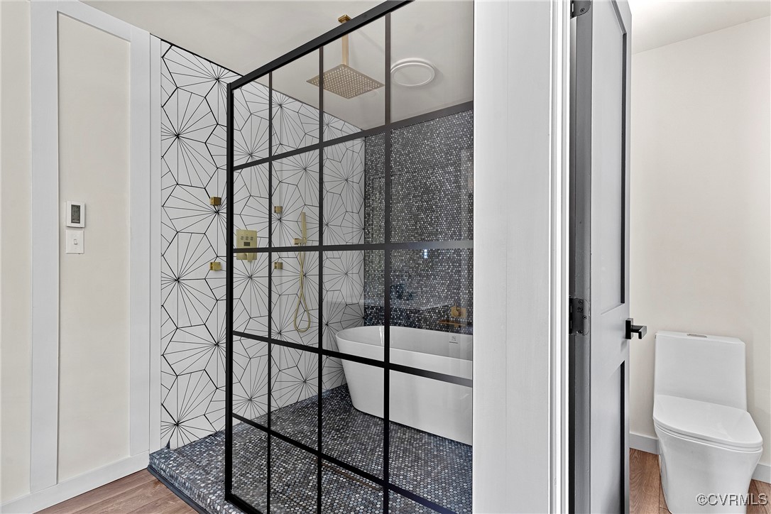 113 Rappa Run Road Topping, VA 23169 - Photo 28 of 49 Bathroom with wood finished floors, a soaking tub,