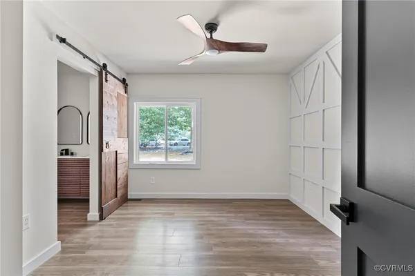 an empty room with wooden floor
