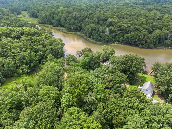 a view of a lake with a yard