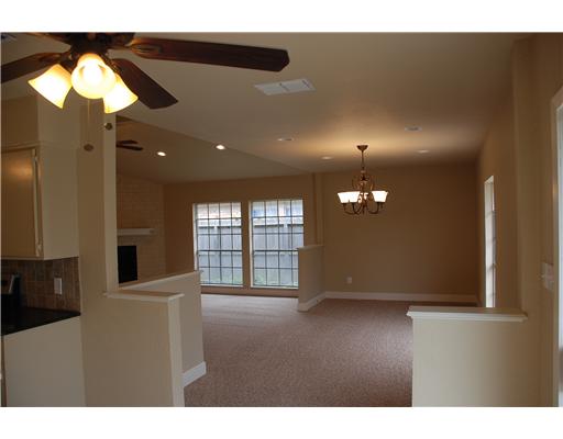 5237 Snowgoose Road Corpus Christi, TX 78413 - Photo 4 of 9 a view of an empty room with a window