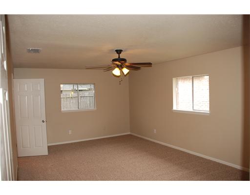 5237 Snowgoose Road Corpus Christi, TX 78413 - Photo 5 of 9 a view of a livingroom with a ceiling fan and window