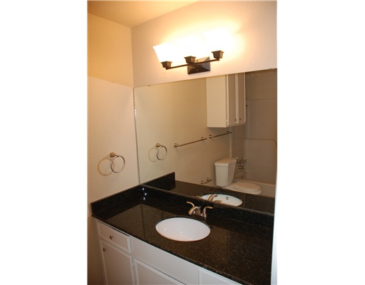 5237 Snowgoose Road Corpus Christi, TX 78413 - Photo 9 of 9 a bathroom with a sink and a mirror