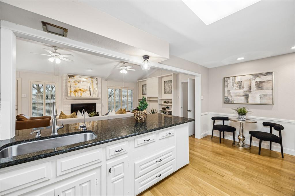 4315 Forest Bend Road Dallas, TX 75244 - Photo 12 of 29 a living room with granite countertop furniture and a fireplace