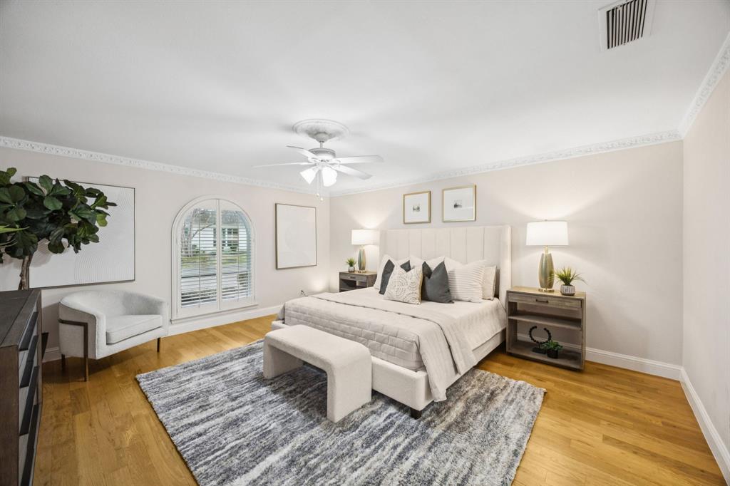 4315 Forest Bend Road Dallas, TX 75244 - Photo 13 of 29 a bedroom with a large bed a rug and a window