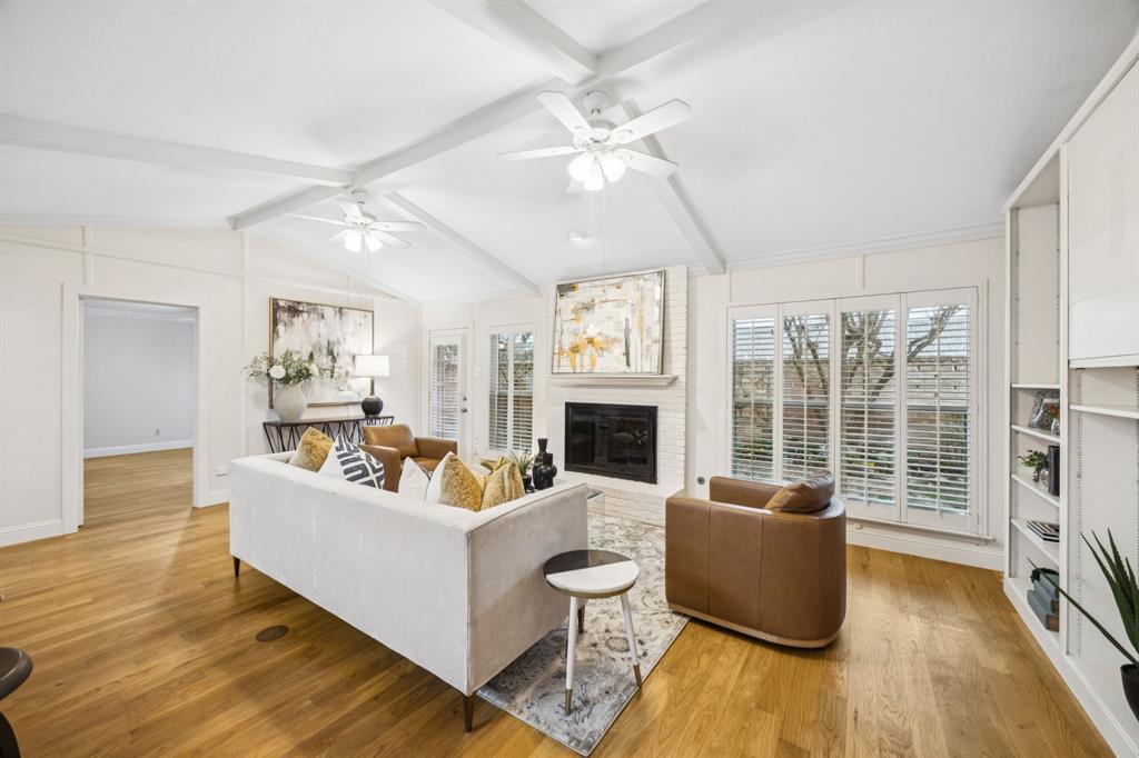4315 Forest Bend Road Dallas, TX 75244 - Photo 8 of 29 a living room with fireplace furniture and a large window