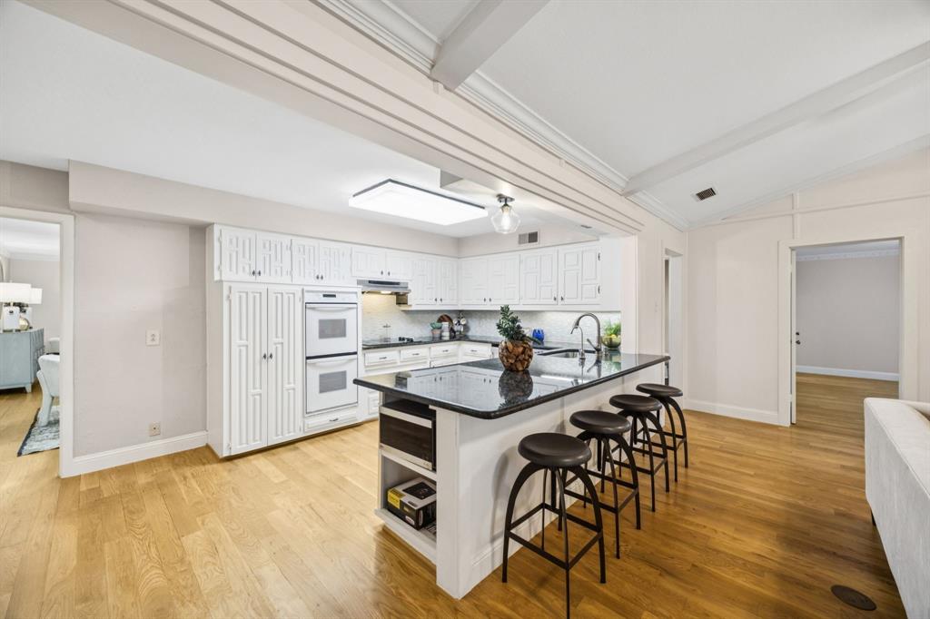 4315 Forest Bend Road Dallas, TX 75244 - Photo 10 of 29 a view of a kitchen and dining room