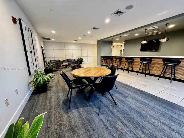 a room with furniture and wooden floor