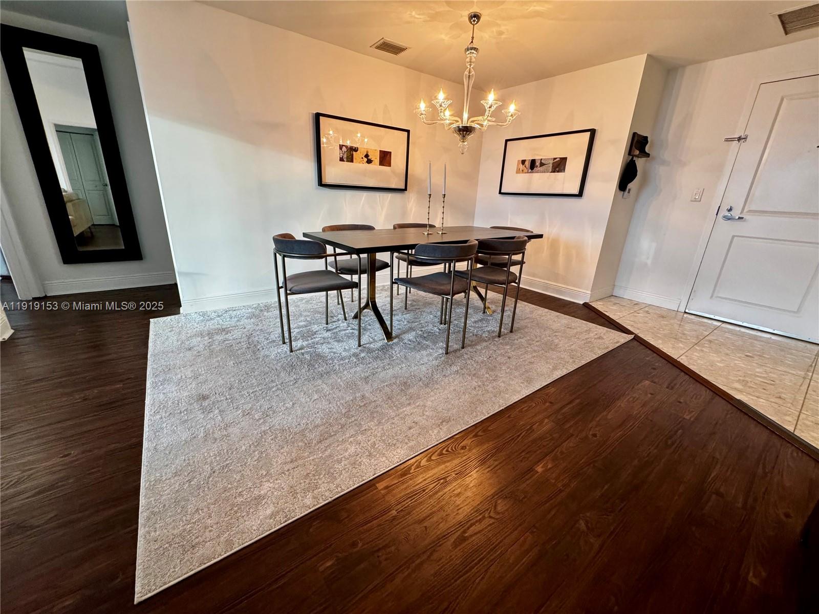 1250 South Miami Avenue, Unit 2403 Miami, FL 33130 - Photo 7 of 28 a view of a dining room with furniture and wooden floor