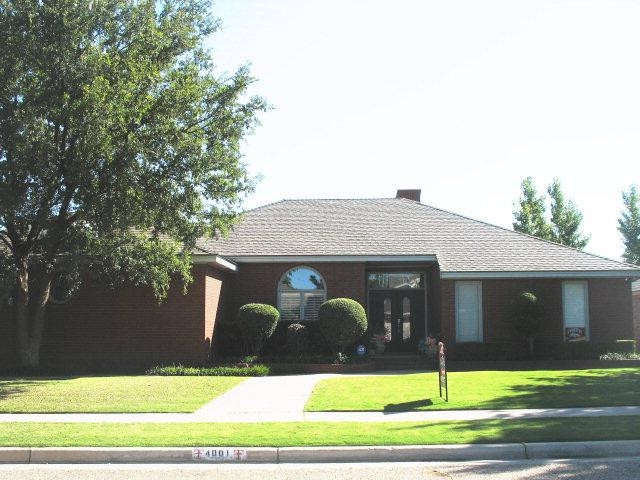 4001 97th Street Lubbock, TX 79423 - Photo 1 of 1 a front view of a house with garden