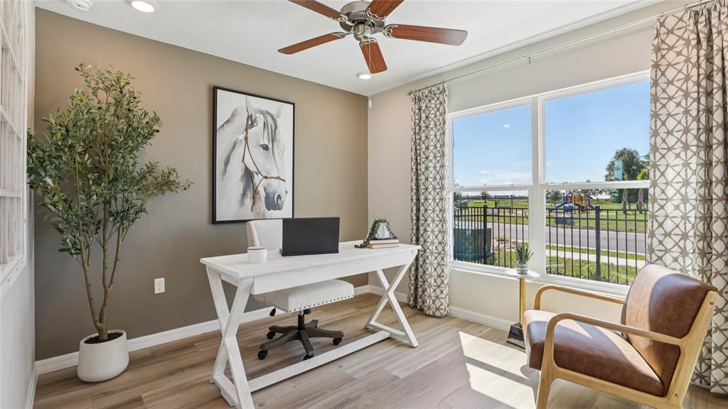 10407 Turtle Run Road Weeki Wachee, FL 34613 - Photo 22 of 31 a workspace with furniture and a potted plant