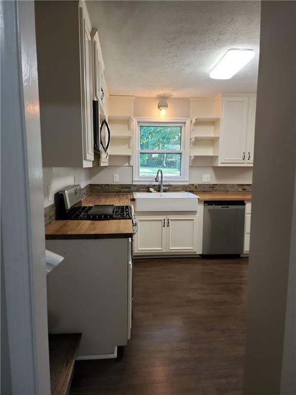 1476 Dupree Road Woodstock, GA 30189 - Photo 16 of 26 a kitchen with a sink and a stove top oven