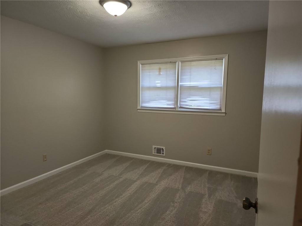 1476 Dupree Road Woodstock, GA 30189 - Photo 18 of 26 an empty room with a window
