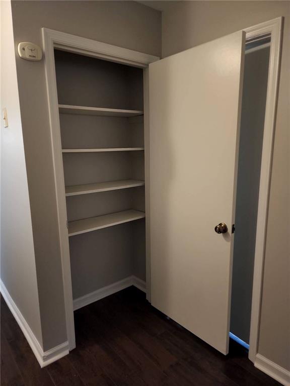 1476 Dupree Road Woodstock, GA 30189 - Photo 19 of 26 a view of walk in closet with empty racks