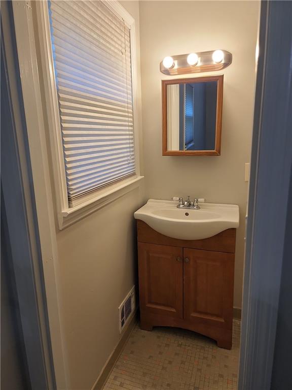 1476 Dupree Road Woodstock, GA 30189 - Photo 23 of 26 a bathroom with a sink and a mirror