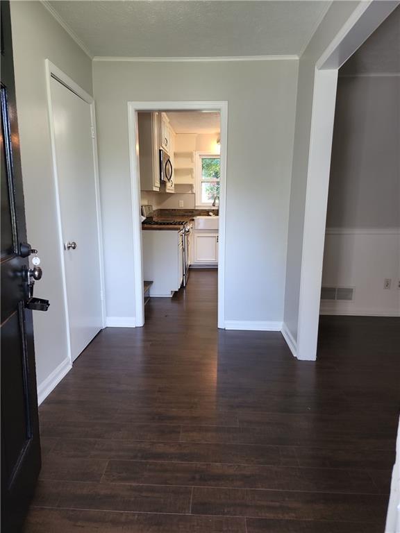 1476 Dupree Road Woodstock, GA 30189 - Photo 3 of 26 a view of a hallway view with wooden floor and a cabinet