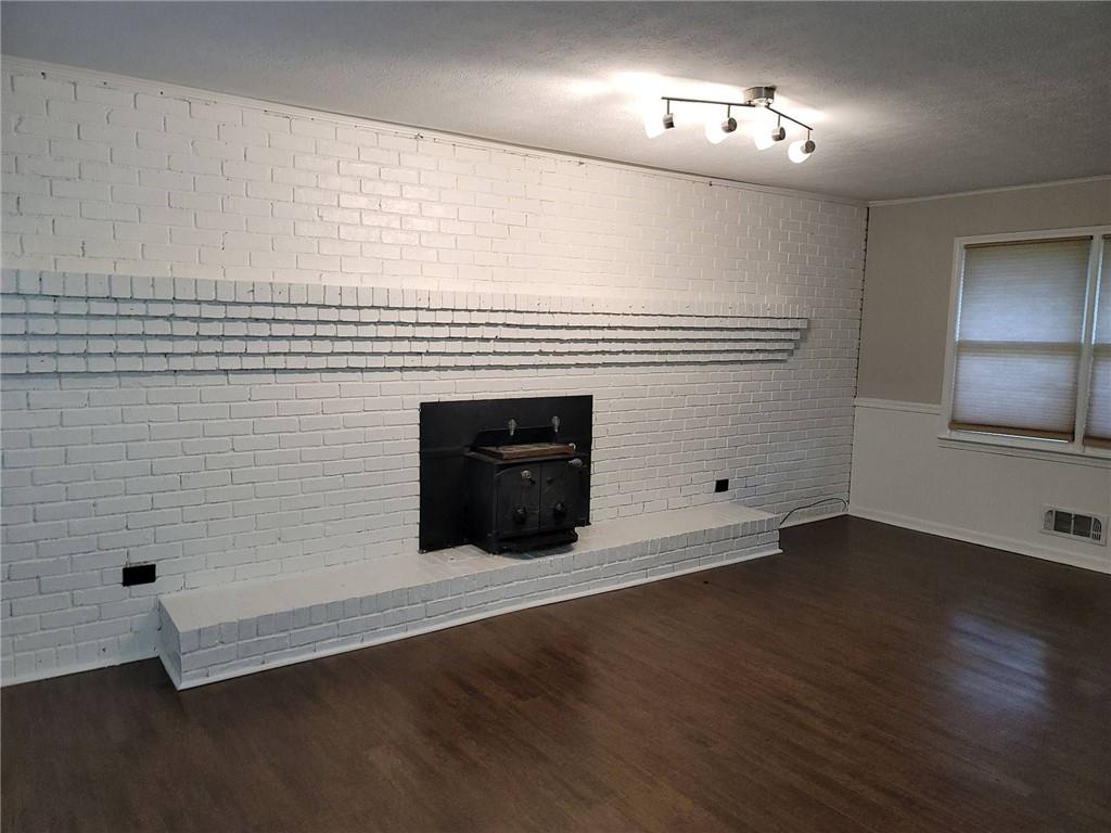 1476 Dupree Road Woodstock, GA 30189 - Photo 6 of 26 an empty room with wooden floor and windows