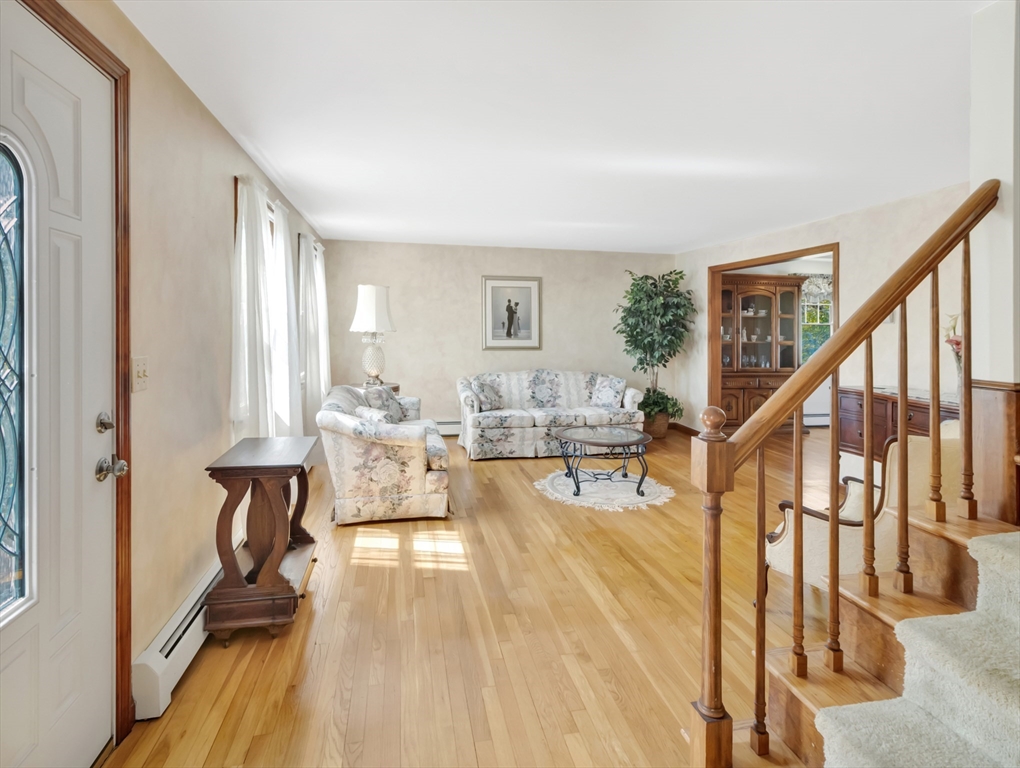 15 Riverside Drive Mansfield, MA 02048 - Photo 11 of 42 a living room with furniture and a wooden floor