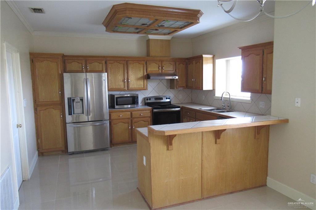 3307 Santa Teresa Mission, TX 78572 - Photo 10 of 33 Open Kitchen - Laundry Room