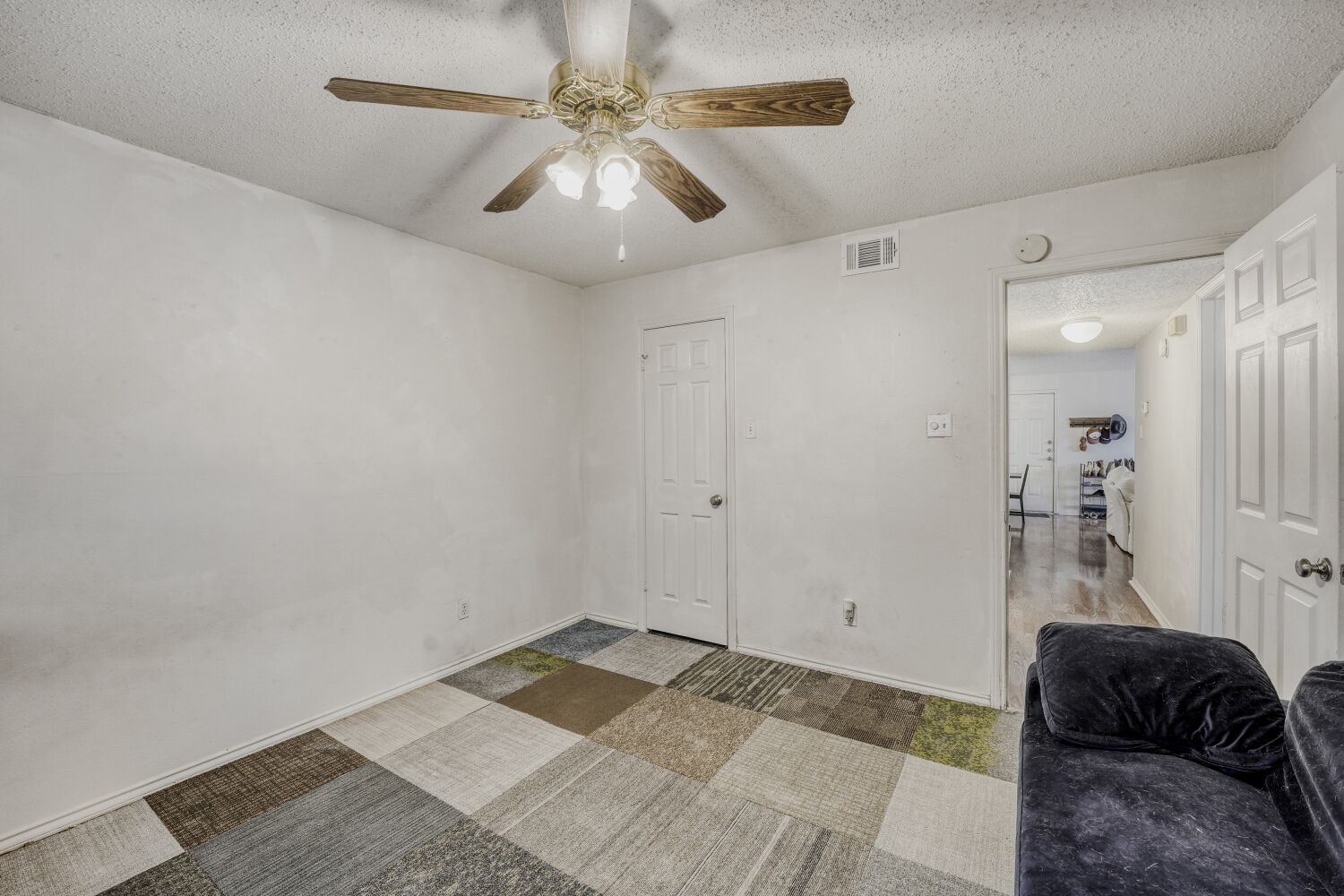 2401 Leon Street, Unit 100 Austin, TX 78705 - Photo 14 of 24 a view of livingroom with a ceiling fan and window