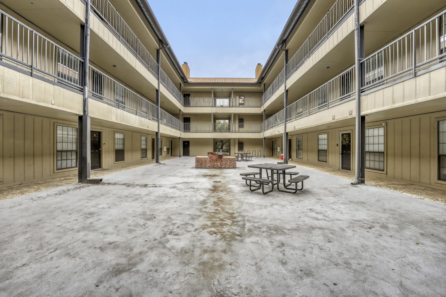 2401 Leon Street, Unit 100 Austin, TX 78705 - Photo 22 of 24 a view of a building with sitting area