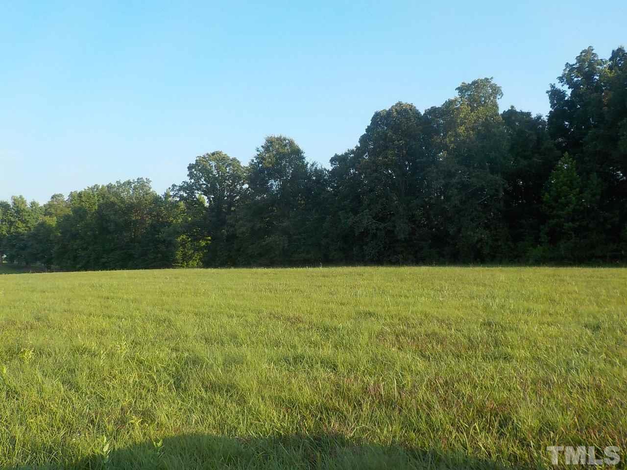 Uzzle Road Rougemont, NC 27572 - Photo 2 of 5 a view of a field with an ocean